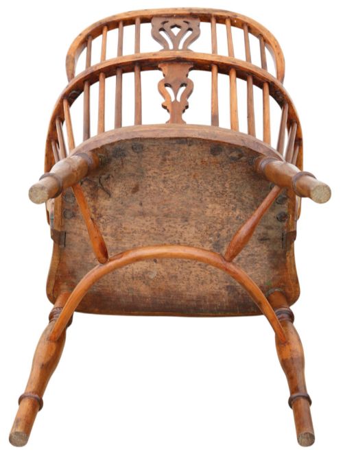 fig 5. A 19th-century yew and elm Windsor armchair featuring a hoop back, pierced central splat, turned legs, and a crinoline stretcher.