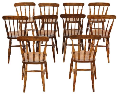 fig 1. A harlequin set of ten 19th-century Victorian dining chairs crafted from elm and beech wood, featuring spindle backs, curved top rails, turned legs, and stretchers.