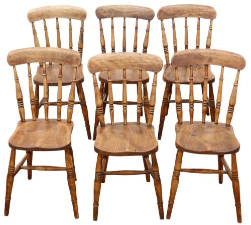 fig 2. A harlequin set of ten 19th-century Victorian dining chairs crafted from elm and beech wood, featuring spindle backs, curved top rails, turned legs, and stretchers.