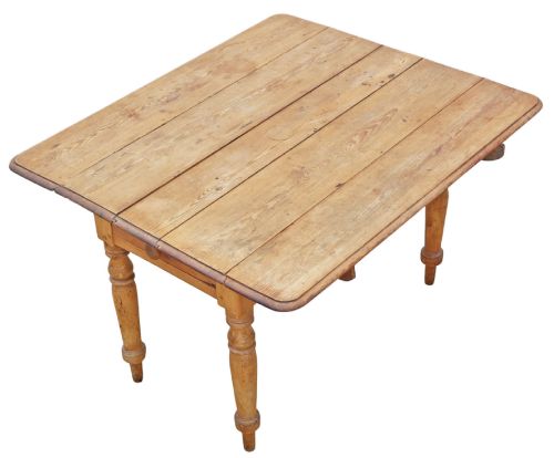 fig 1. A 19th-century Victorian pine drop-leaf table featuring turned legs, a planked top surface, and a single end drawer with a wooden knob handle.