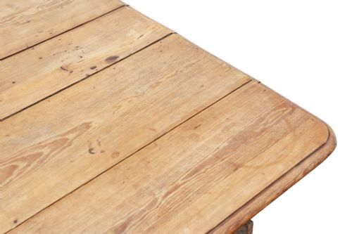 fig 3. A 19th-century Victorian pine drop-leaf table featuring turned legs, a planked top surface, and a single end drawer with a wooden knob handle.