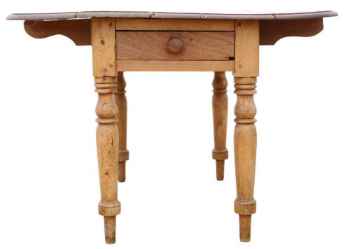 fig 5. A 19th-century Victorian pine drop-leaf table featuring turned legs, a planked top surface, and a single end drawer with a wooden knob handle.