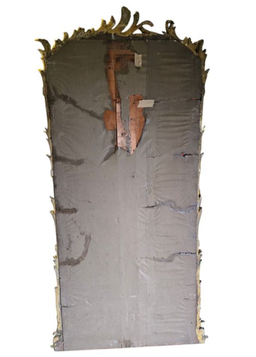 fig 6. A large 19th-century tall wall mirror featuring an ornate gilded wood frame with hand-carved acanthus leaf cresting and scrollwork.