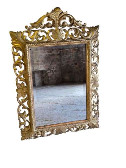 fig 1. A rectangular 19th-century Florentine wall mirror featuring a carved openwork giltwood frame with scrolling acanthus leaves.