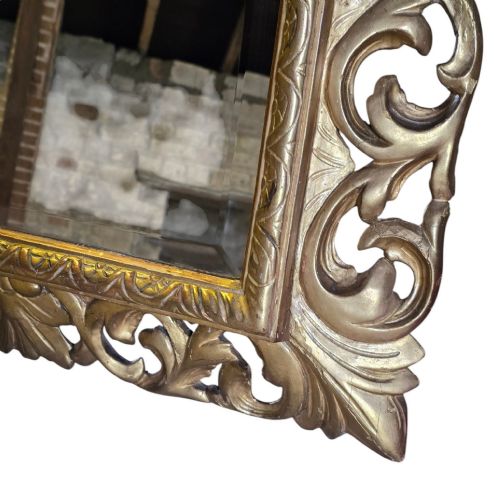 fig 4. A rectangular 19th-century Florentine wall mirror featuring a carved openwork giltwood frame with scrolling acanthus leaves.