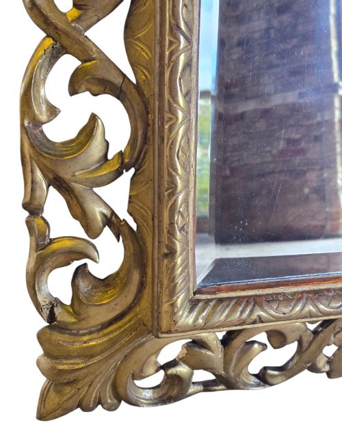 fig 5. A rectangular 19th-century Florentine wall mirror featuring a carved openwork giltwood frame with scrolling acanthus leaves.
