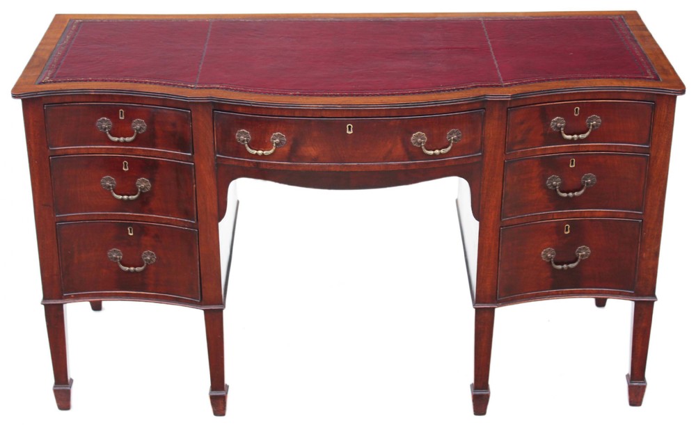 Edwardian serpentine mahogany leather desk
