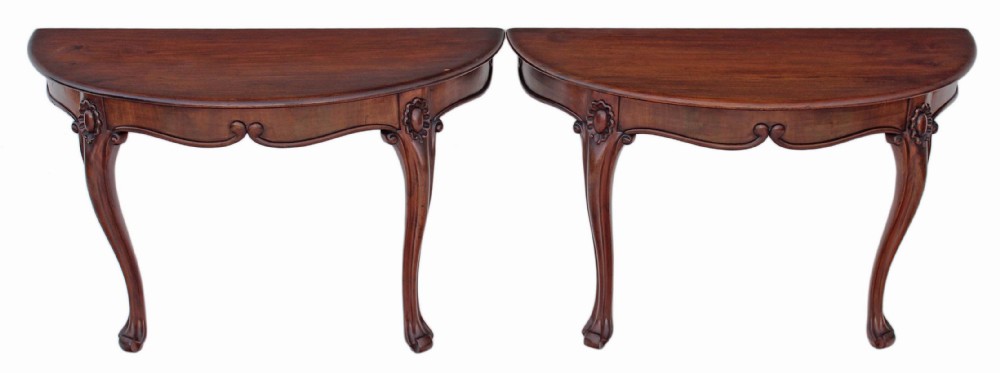 Pair of Victorian carved mahogany console tables