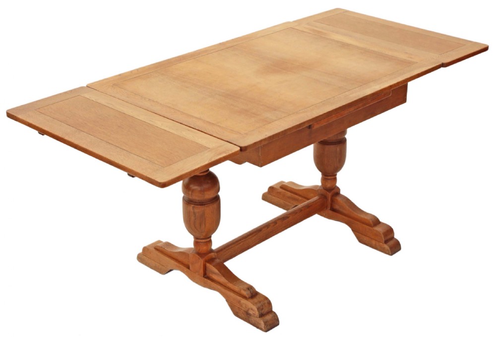 Mid oak drawer leaf extending refectory dining table