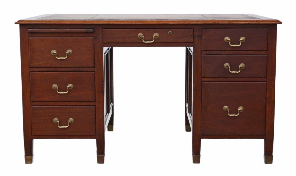 A mahogany twin pedestal writing desk featuring a worn brown leather top insert, multiple drawers with brass handles, and square tapered feet. View II