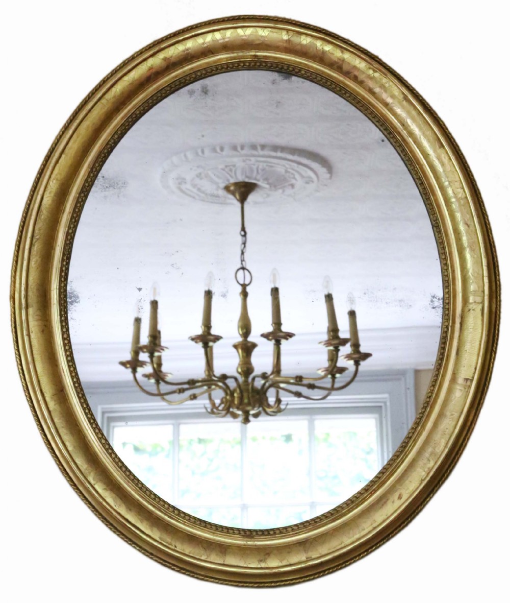 Antique large fine quality oval 19th Century gilt overmantle wall mirror