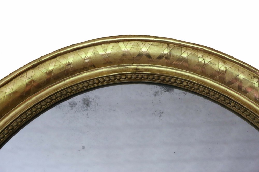 Antique large fine quality oval 19th Century gilt overmantle wall mirror View II