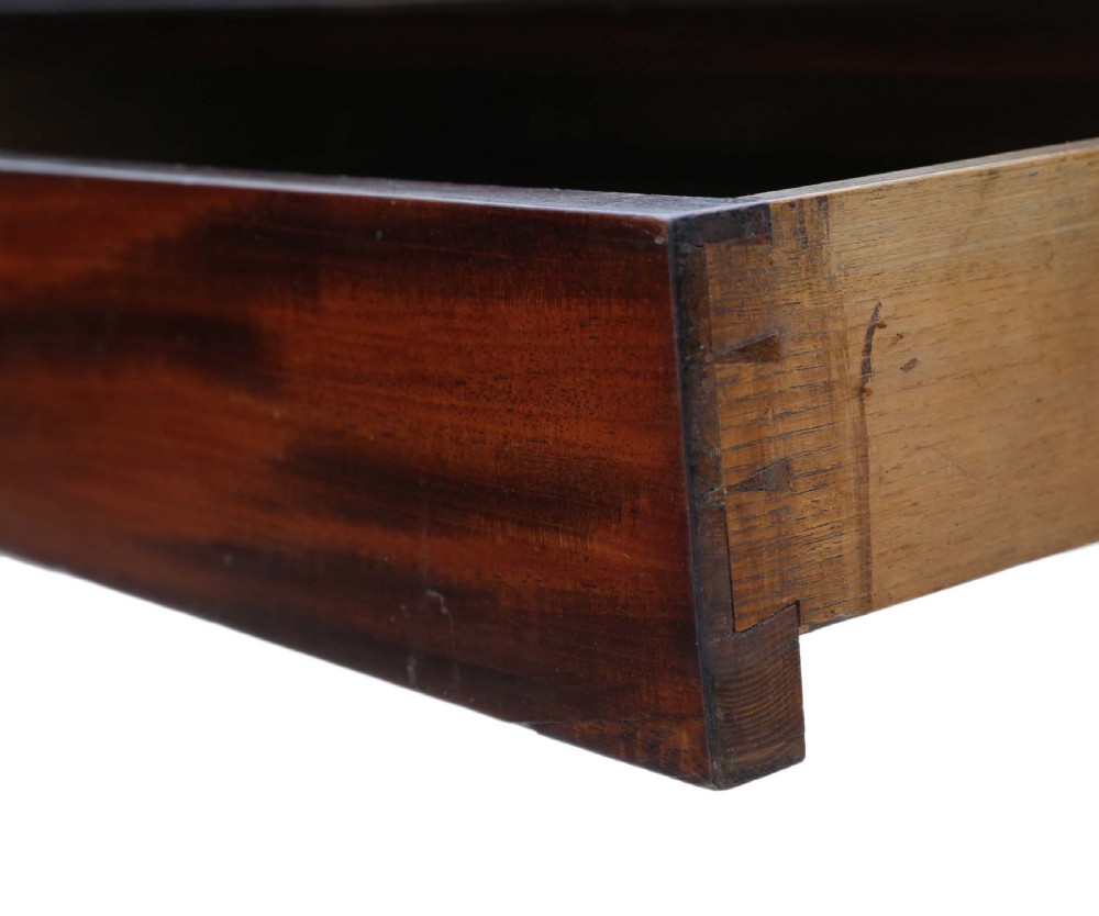 A Regency period Cuban mahogany drop leaf dining table extended with a central pedestal and four reeded splayed legs on brass castors. View VIII