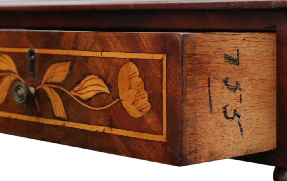 A 19th-century walnut swing mirror with intricate floral marquetry inlay across the frame, twin base drawers, and curved side supports. View VII