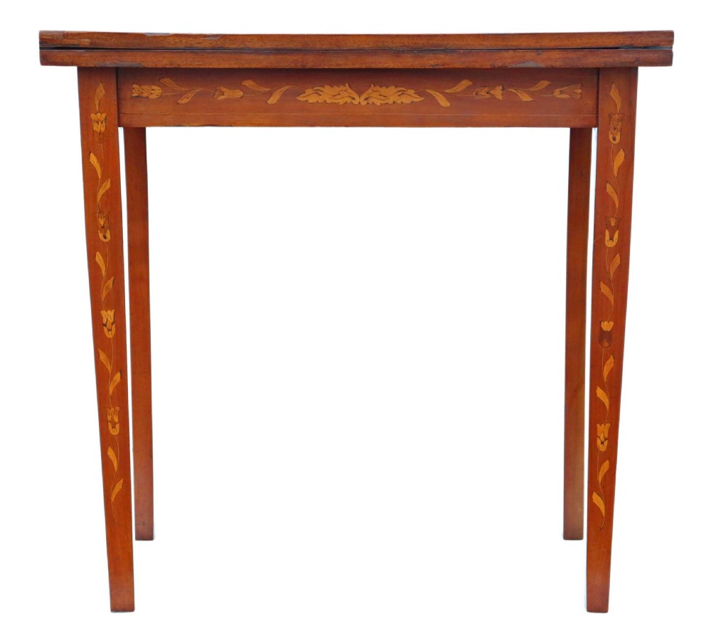 A Victorian mahogany fold-over card table decorated with central urn floral marquetry inlays on the top and tapered legs. View II