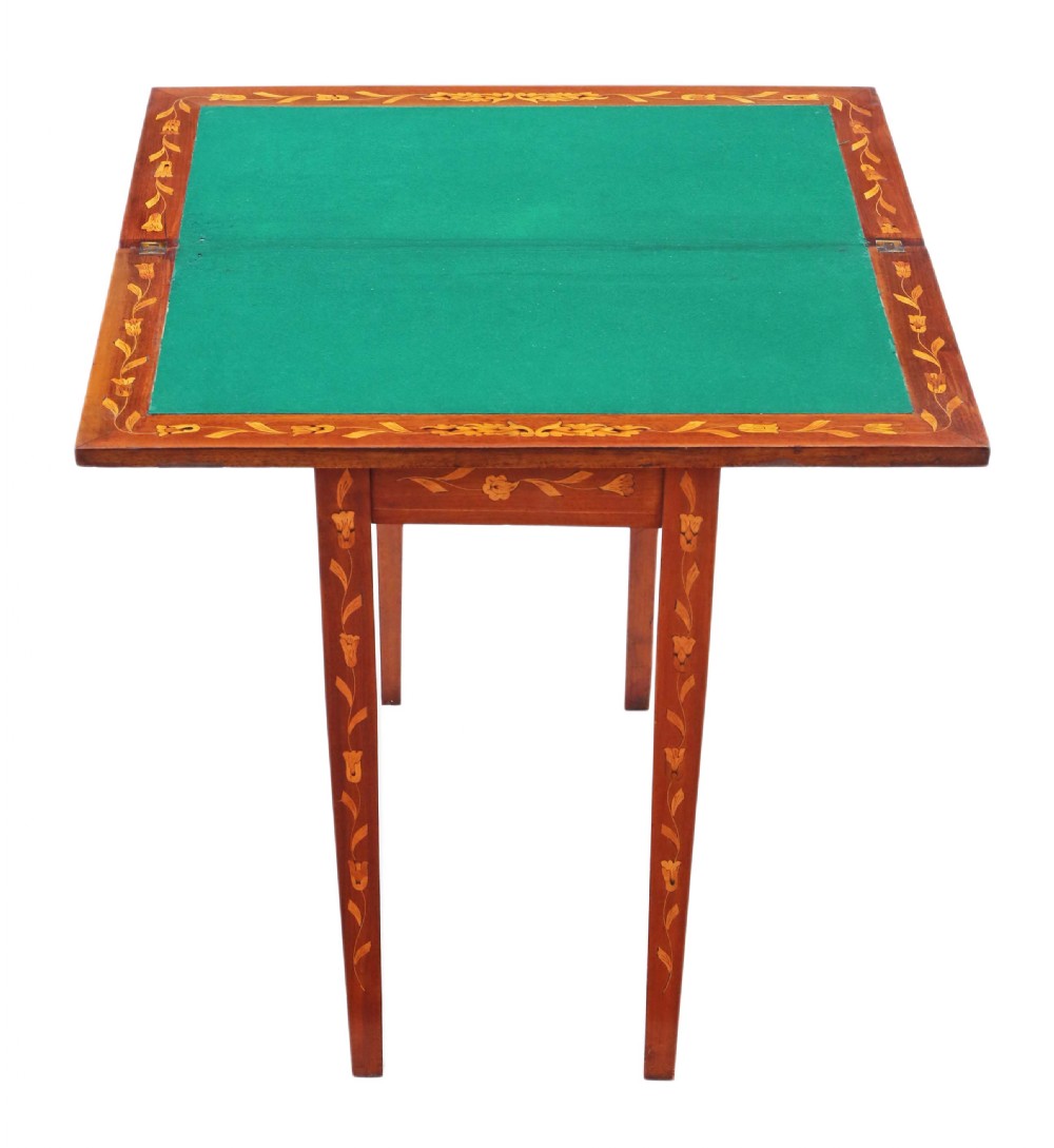 A Victorian mahogany fold-over card table decorated with central urn floral marquetry inlays on the top and tapered legs. View III