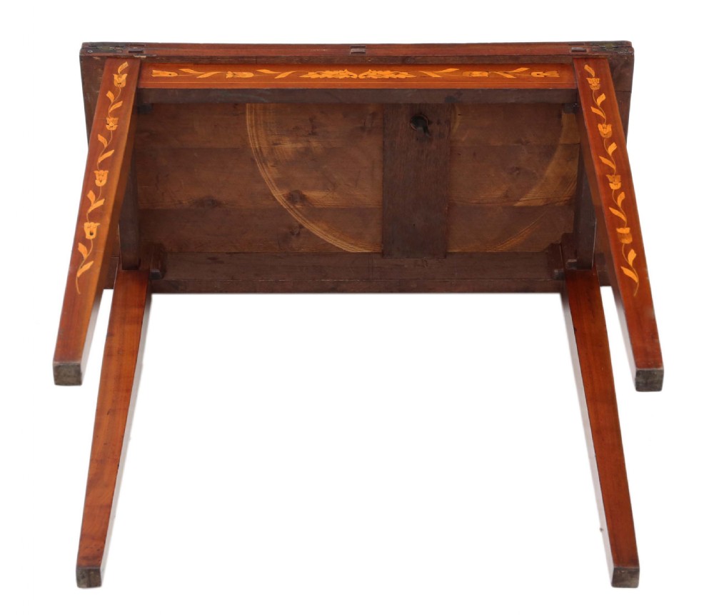 A Victorian mahogany fold-over card table decorated with central urn floral marquetry inlays on the top and tapered legs. View IX