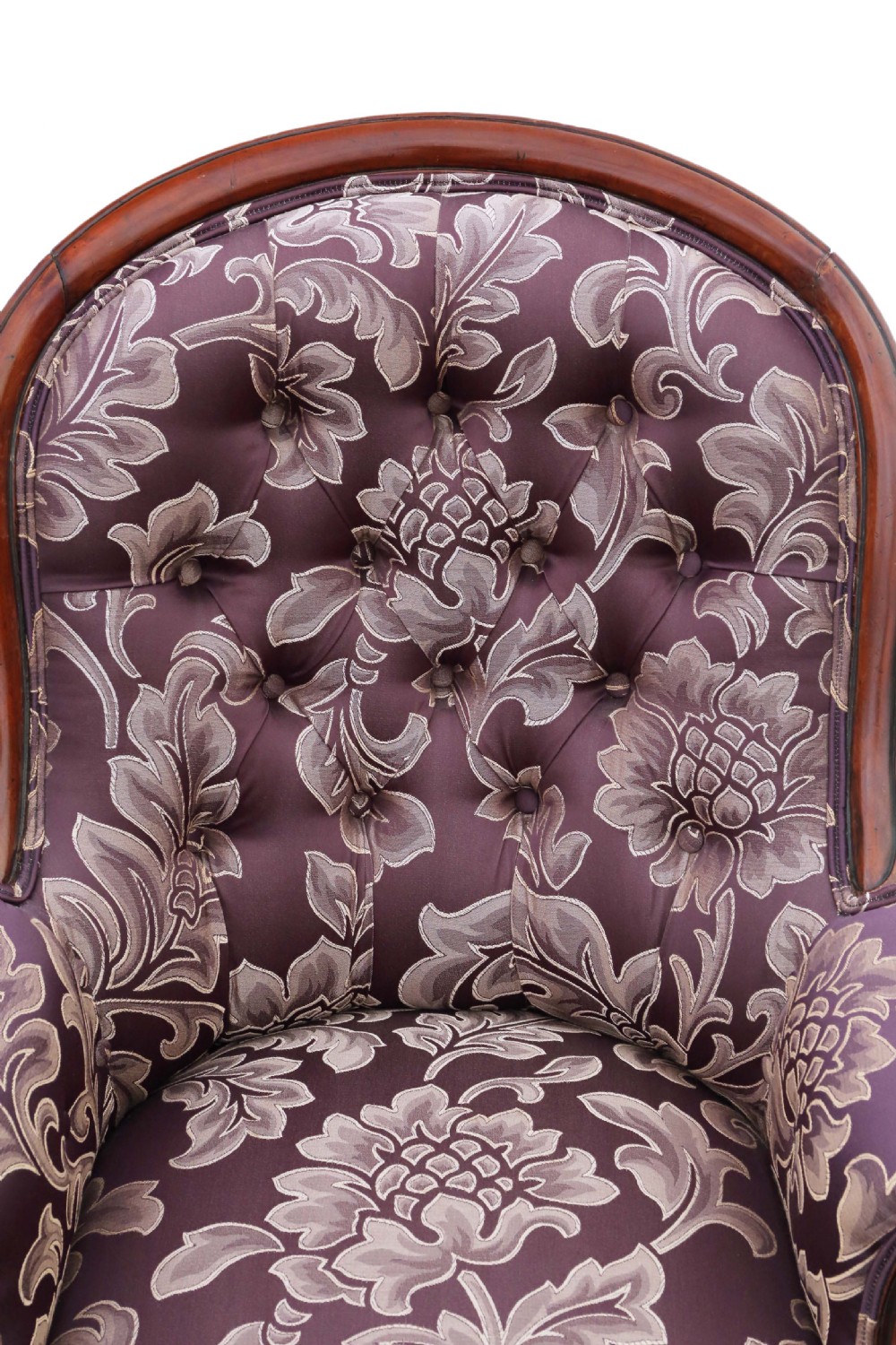 A Victorian mahogany spoon back armchair upholstered in deep purple damask fabric with deep buttoning and cabriole legs. View IX