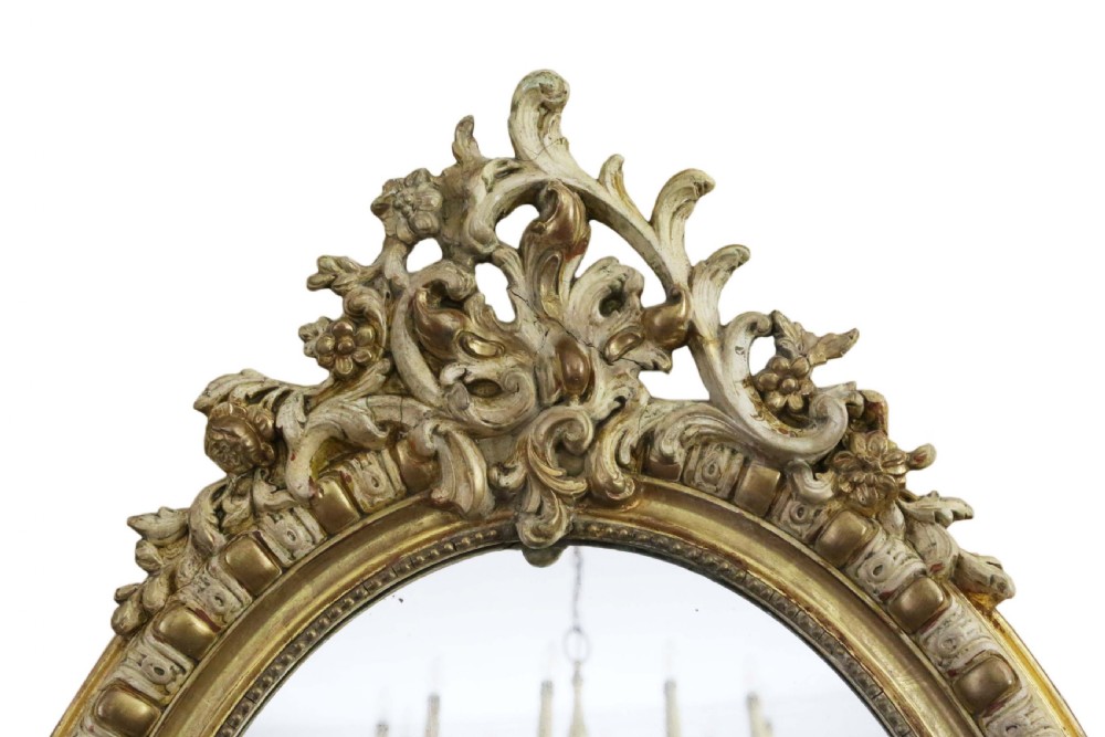 Large 19th Century oval gilt and cream decorated overmantle wall mirror  View II
