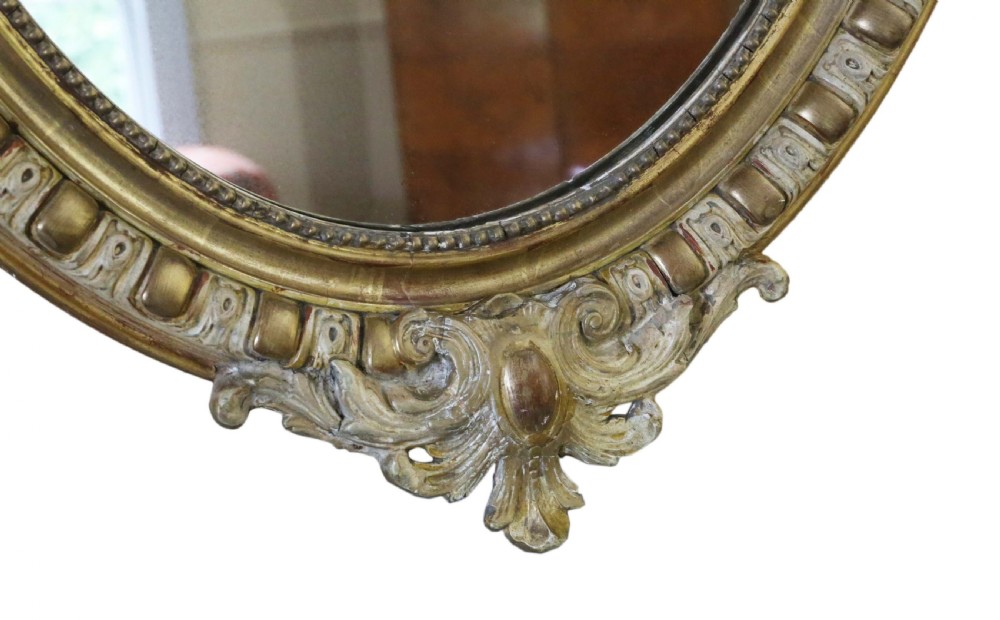 Large 19th Century oval gilt and cream decorated overmantle wall mirror  View V