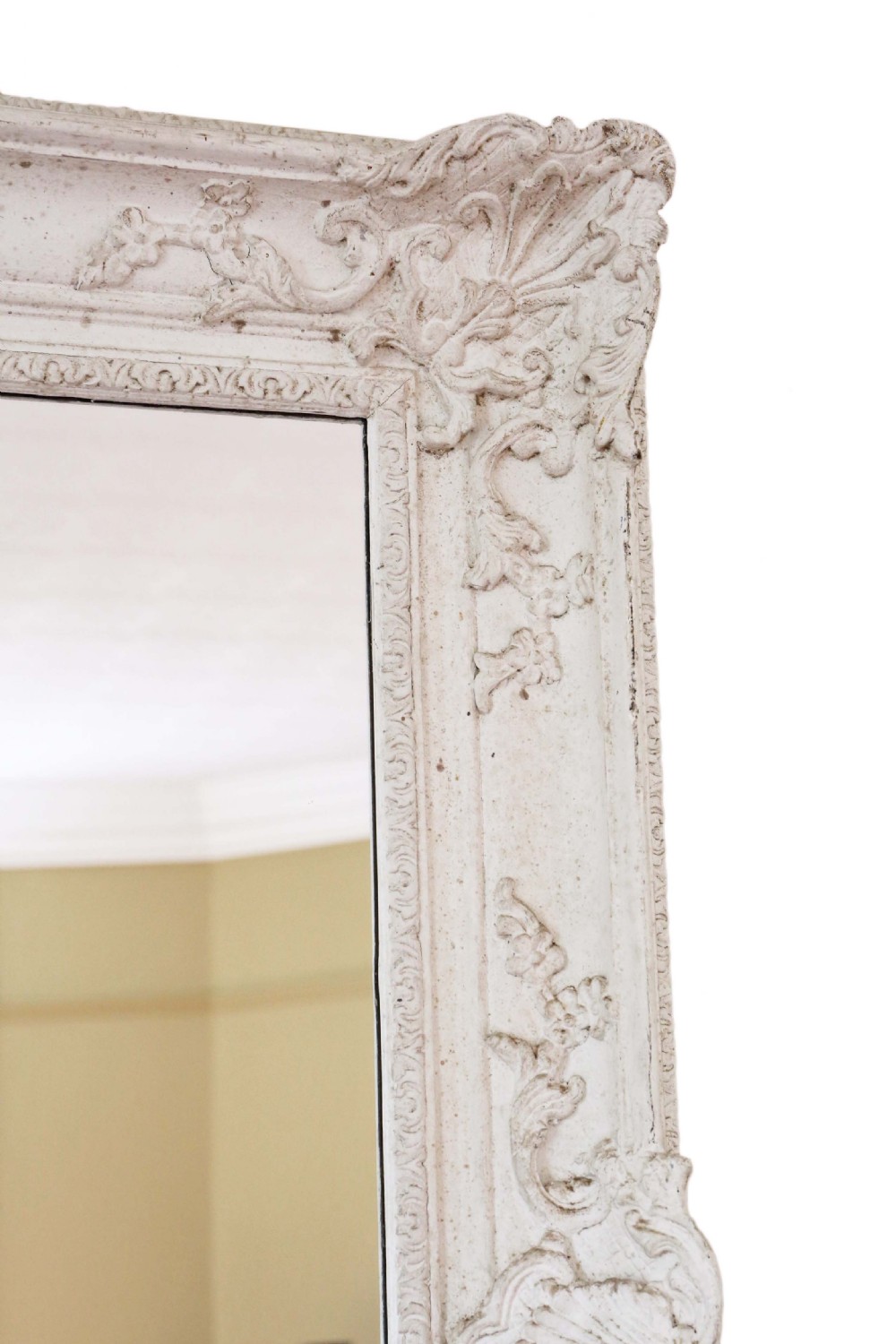 A large rectangular overmantel mirror featuring an off-white carved gesso frame decorated with scallop shell motifs, foliage, and corner crests. View III