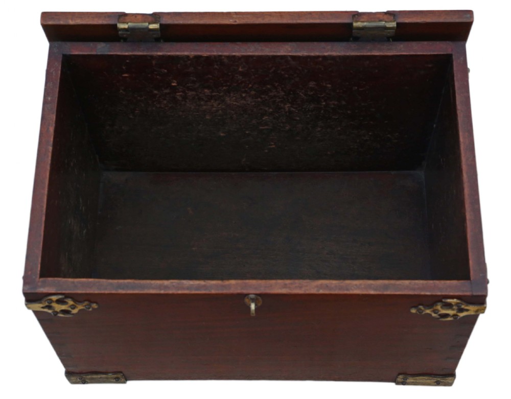 A rectangular mahogany wooden box featuring decorative brass corner mounts, top strap hinges, and a central brass clasp mechanism. View II