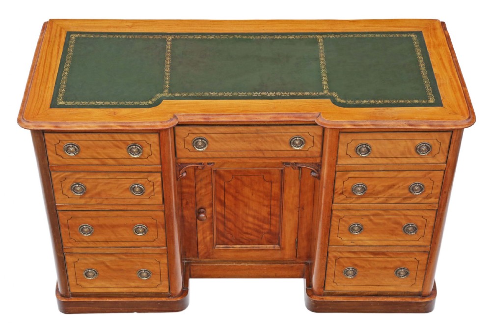 A Victorian satin walnut pedestal desk featuring a green gilt-tooled leather writing surface, multiple drawers with drop ring handles, and a central cupboard door. View II