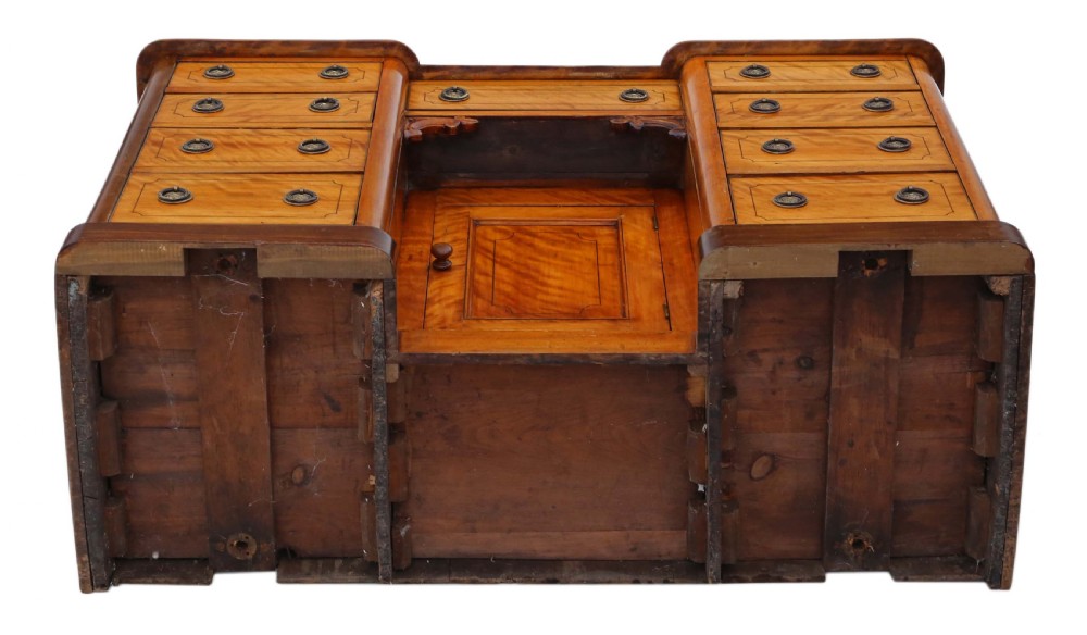 A Victorian satin walnut pedestal desk featuring a green gilt-tooled leather writing surface, multiple drawers with drop ring handles, and a central cupboard door. View VIII