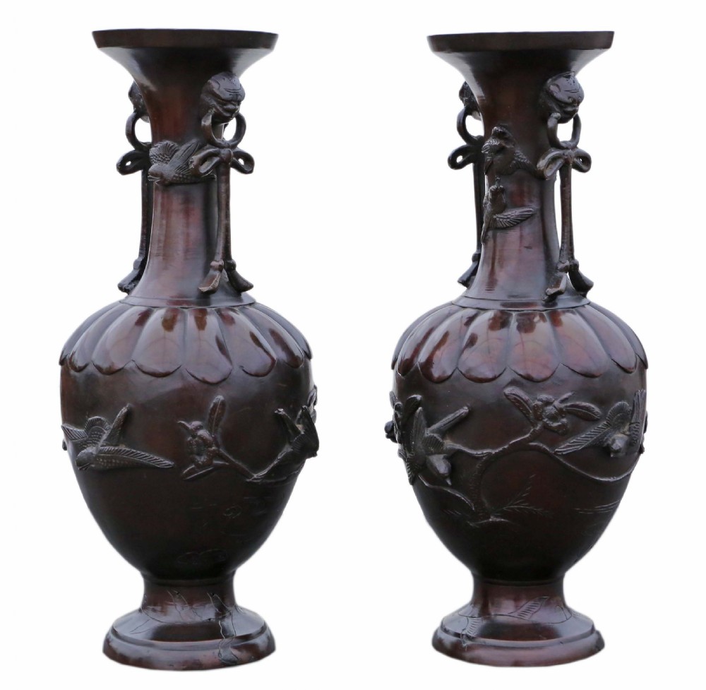 A pair of large Japanese dark bronze presentation vases featuring high-relief bird motifs alongside stylized drop handles. View II