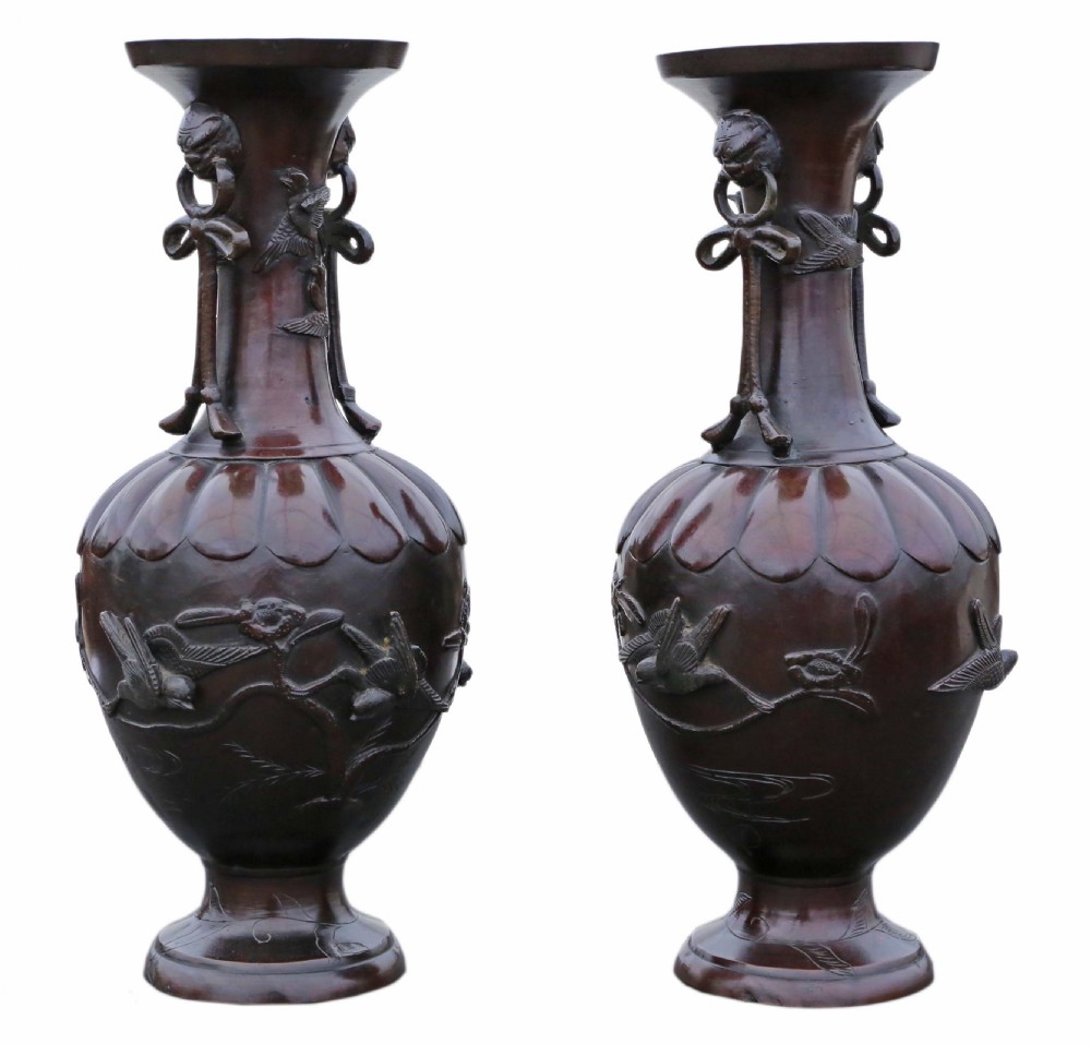 A pair of large Japanese dark bronze presentation vases featuring high-relief bird motifs alongside stylized drop handles. View III