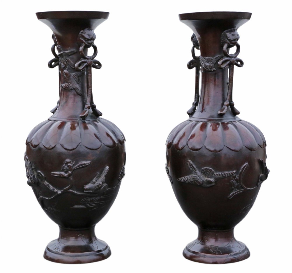 A pair of large Japanese dark bronze presentation vases featuring high-relief bird motifs alongside stylized drop handles. View V