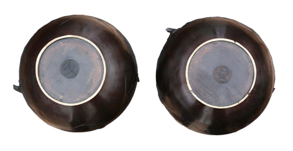 A pair of large Japanese bronze baluster vases featuring relief decoration of birds amidst flowering branches against a dark brown patinated finish. View VI