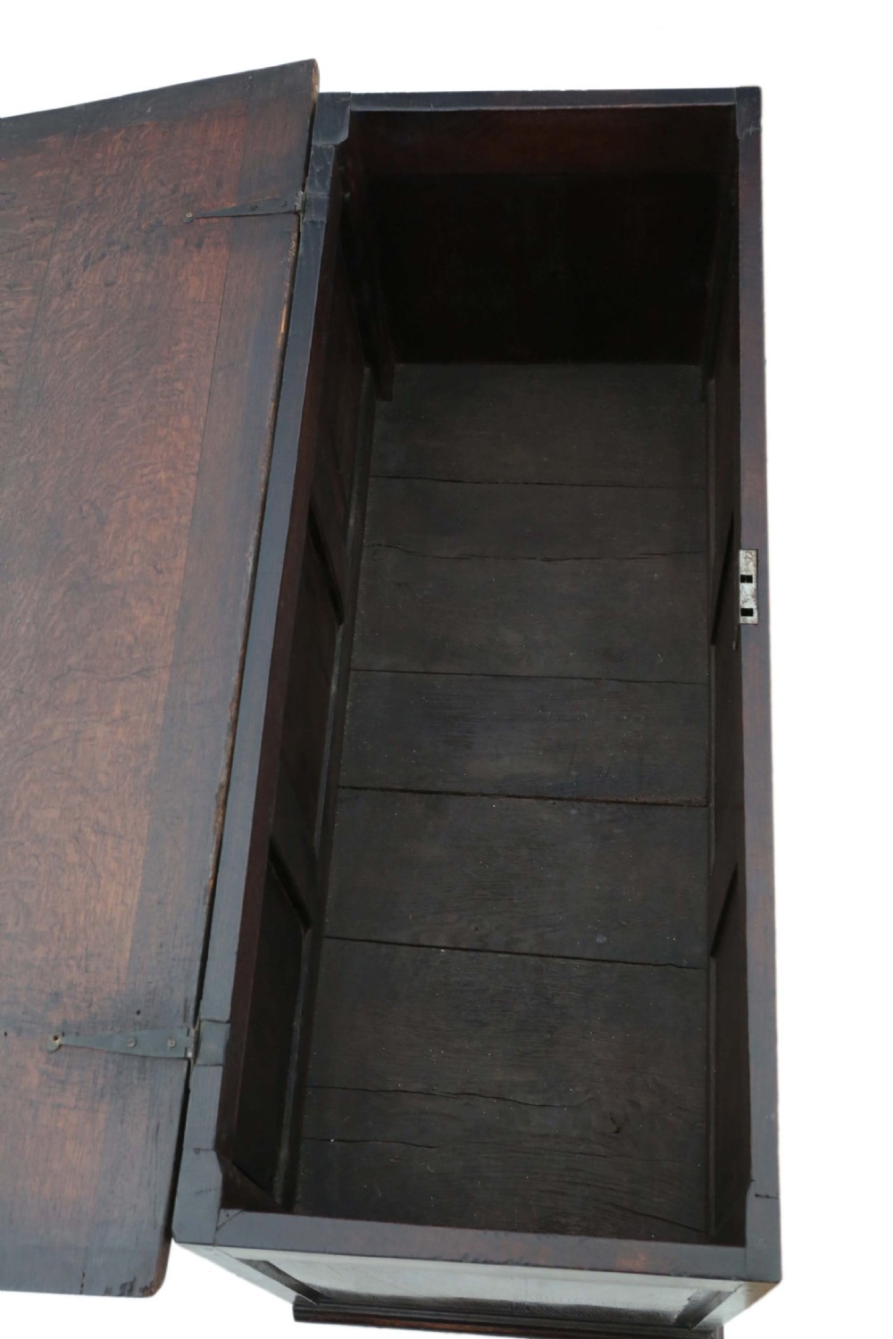 A dark oak Georgian mule chest featuring a carved wave frieze, three fielded front panels, two base drawers with brass handles, and square feet. View VIII