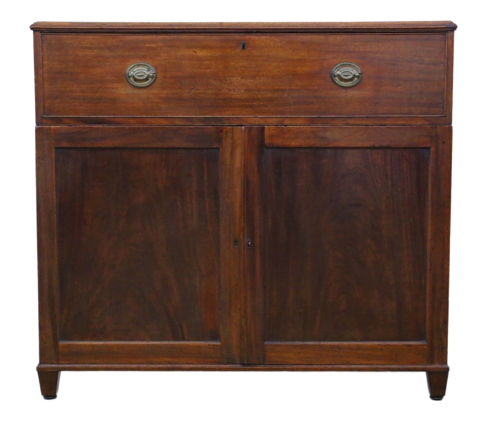 A 19th-century rich mahogany cabinet featuring a single top drawer with oval brass handles above two panelled cupboard doors. View II