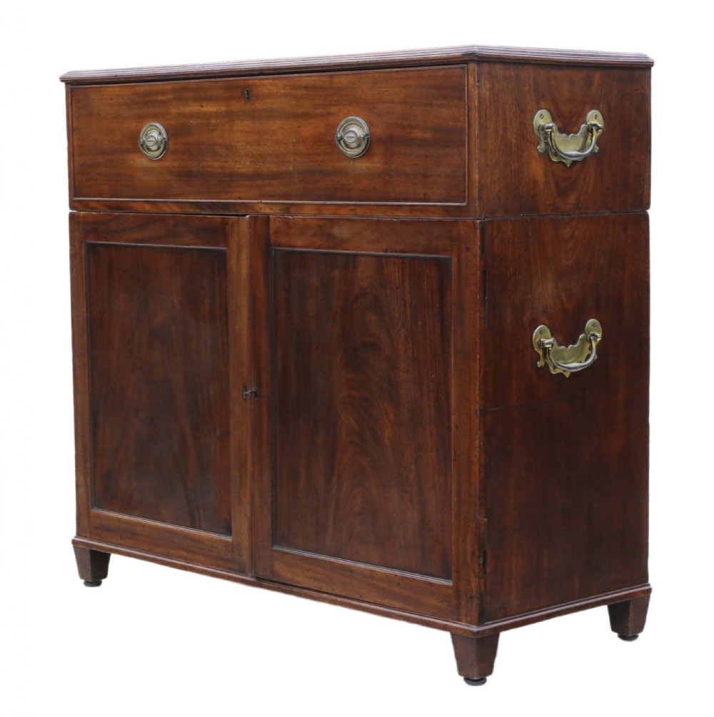 A 19th-century rich mahogany cabinet featuring a single top drawer with oval brass handles above two panelled cupboard doors. View V