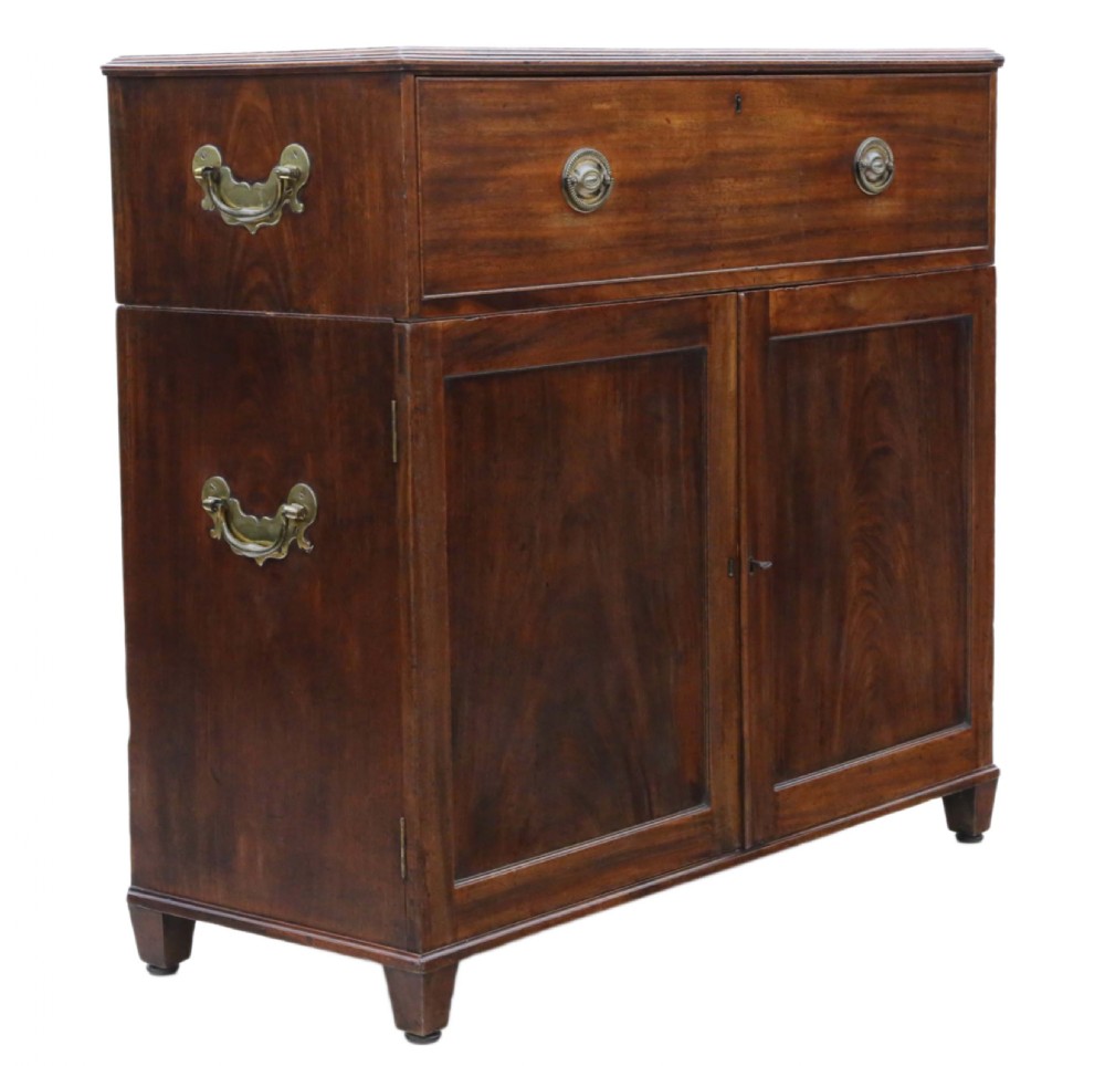 A 19th-century rich mahogany cabinet featuring a single top drawer with oval brass handles above two panelled cupboard doors. View IX