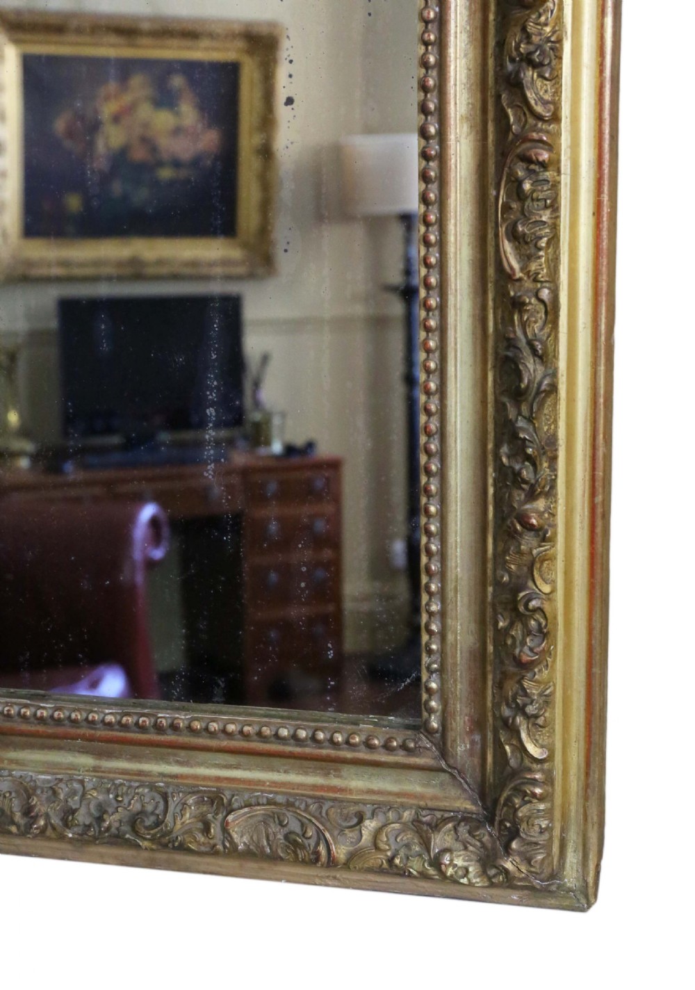 A tall 19th-century arched giltwood overmantel mirror featuring an ornate carved shell crest and decorative moulded frame. View VI