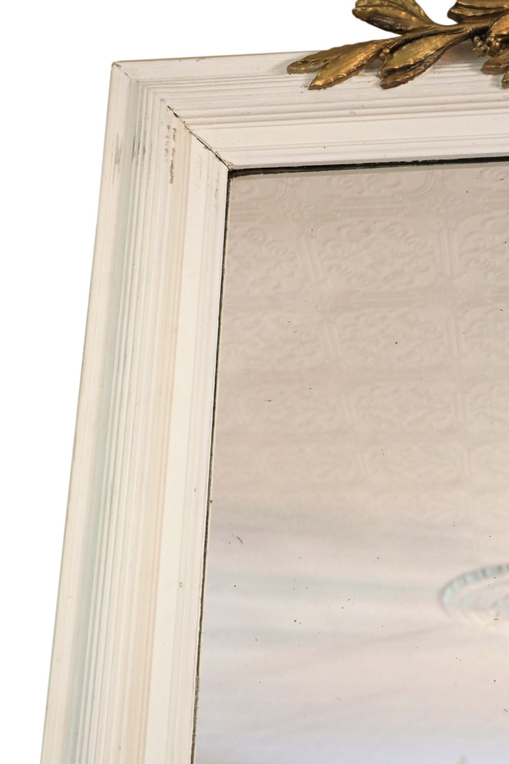 A large 19th-century rectangular wall mirror featuring a painted white frame topped with an ornate gilded crest. View IV