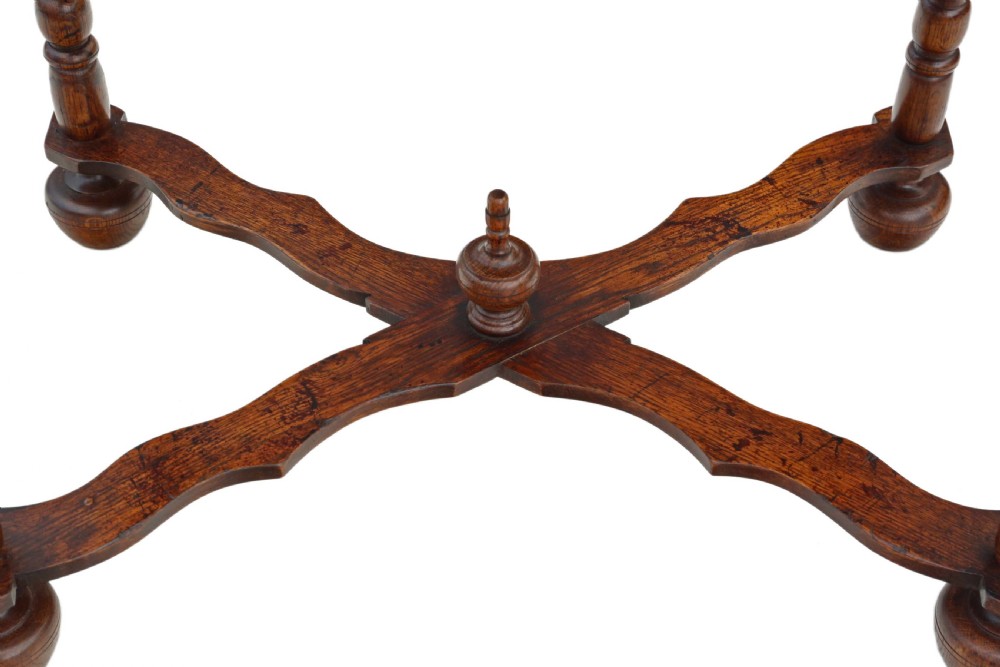 A Queen Anne revival walnut side table featuring a circular oyster veneer top pattern, a single drawer with brass handles, turned legs, and an X-stretcher. View VII