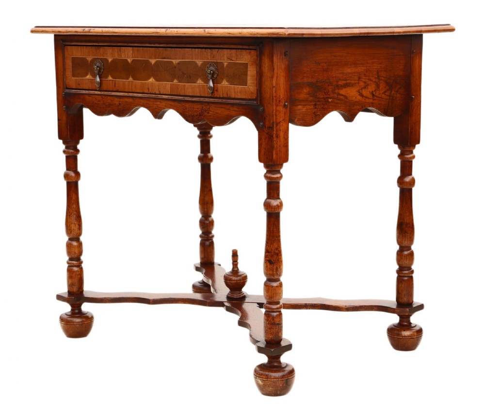A Queen Anne revival walnut side table featuring a circular oyster veneer top pattern, a single drawer with brass handles, turned legs, and an X-stretcher. View IX