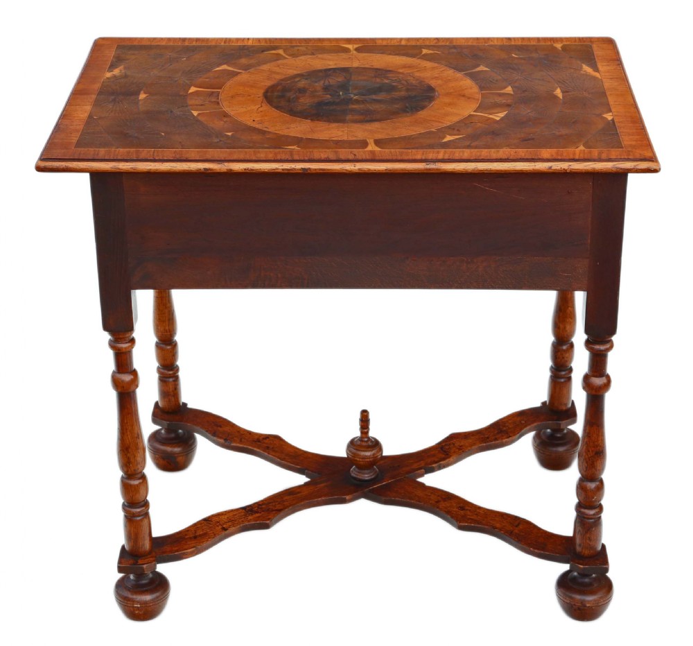 A Queen Anne revival walnut side table featuring a circular oyster veneer top pattern, a single drawer with brass handles, turned legs, and an X-stretcher. View XI