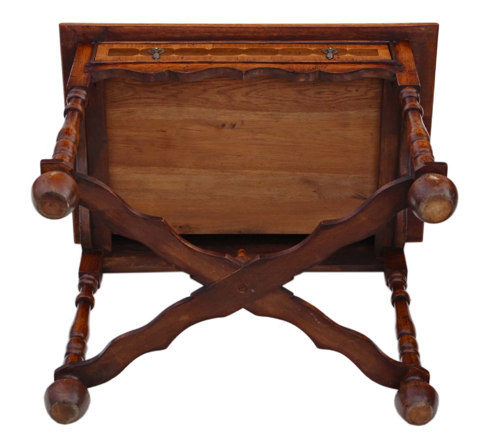 A Queen Anne revival walnut side table featuring a circular oyster veneer top pattern, a single drawer with brass handles, turned legs, and an X-stretcher. View XII