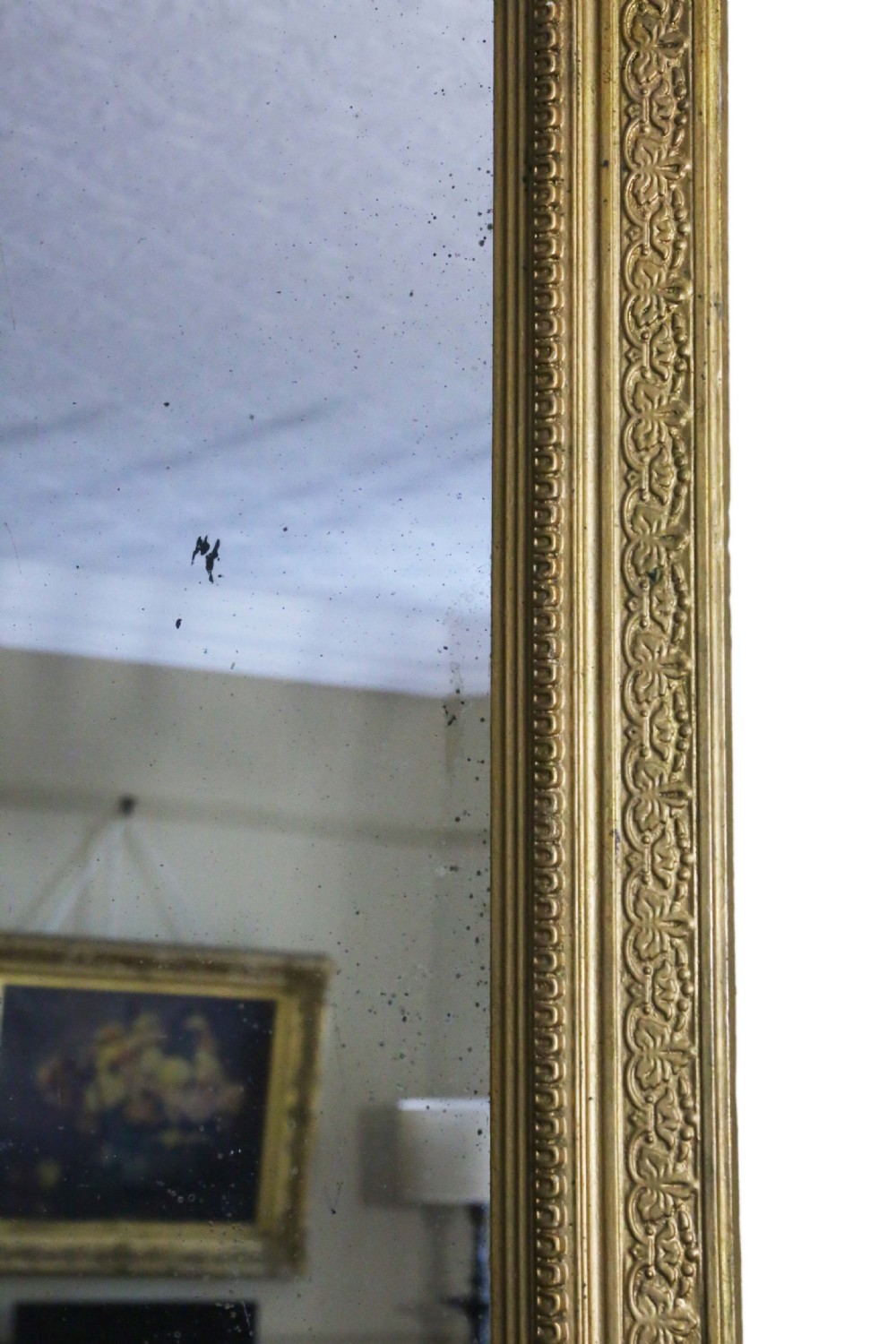 A tall 19th-century rectangular giltwood overmantel mirror featuring an ornate acanthus leaf crest and decorative moulded frame. View III
