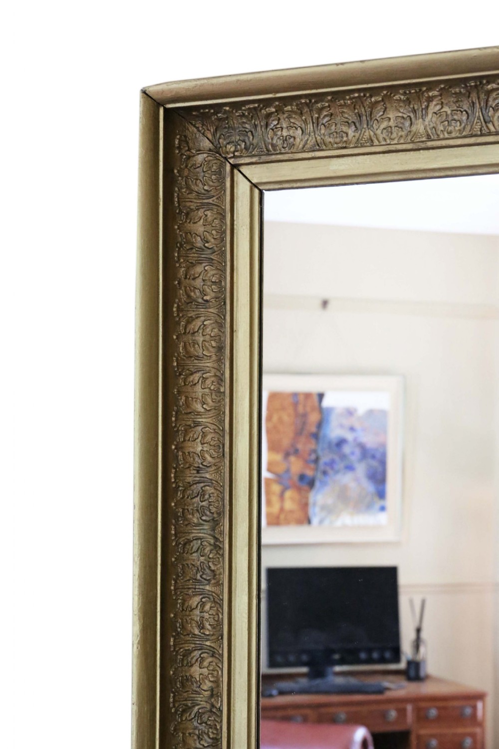 A large mid-19th-century rectangular mirror featuring a heavy gold gilt frame with carved foliage moulding. View II