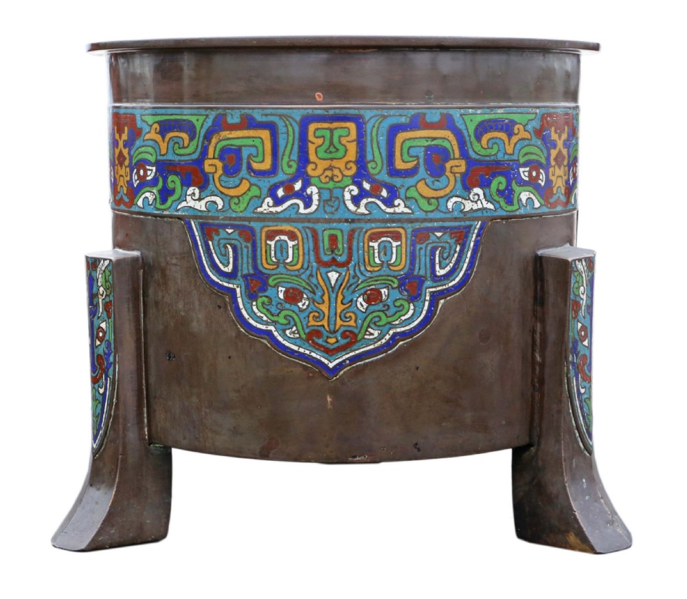 A large dark bronze planter decorated with colourful champleve enamel scroll patterns, supported by four cast feet. View III