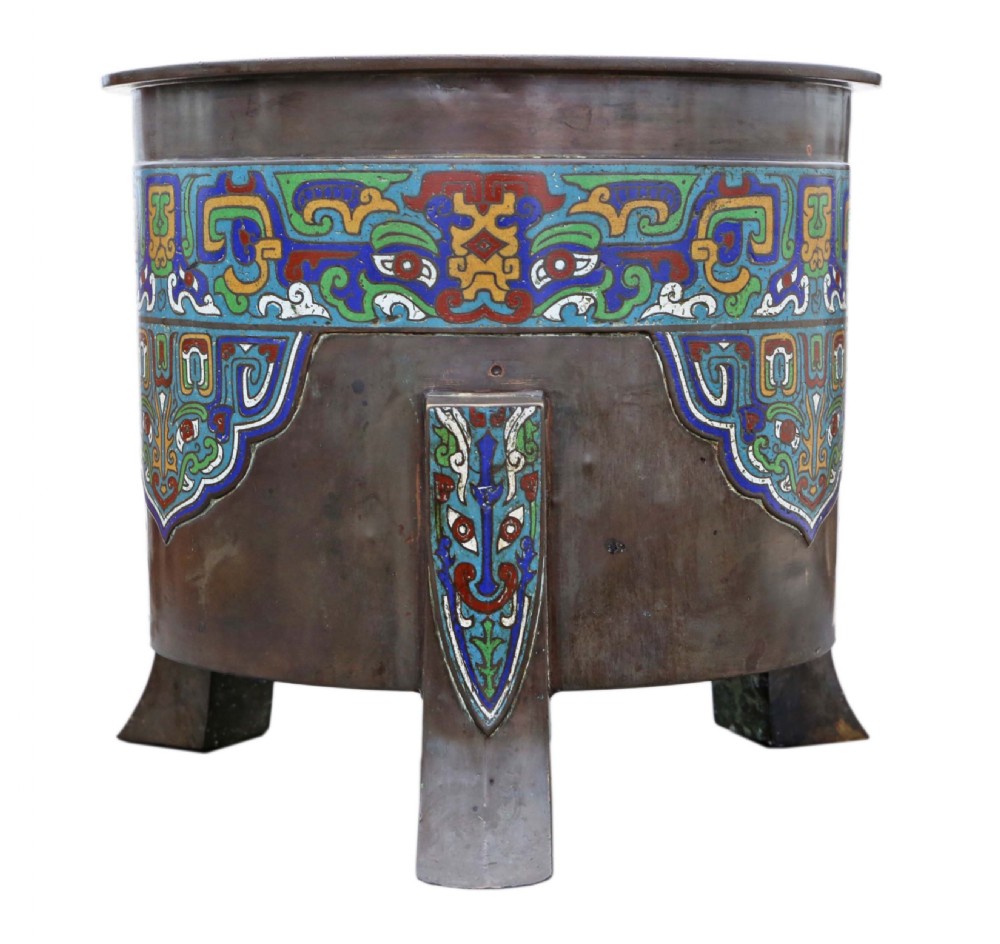 A large dark bronze planter decorated with colourful champleve enamel scroll patterns, supported by four cast feet. View V