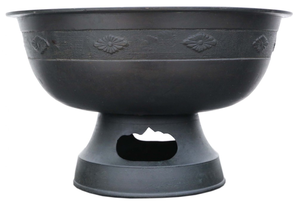 A dark bronze Japanese Edo period vessel featuring a flared rim with floral relief bands set upon a flared pedestal base. View II