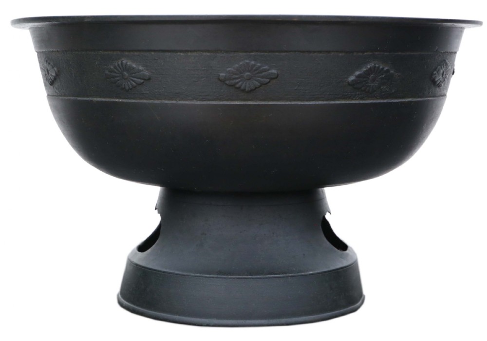 A dark bronze Japanese Edo period vessel featuring a flared rim with floral relief bands set upon a flared pedestal base. View III