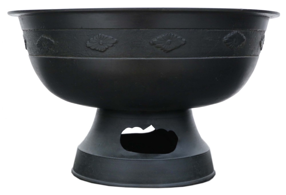 A dark bronze Japanese Edo period vessel featuring a flared rim with floral relief bands set upon a flared pedestal base. View IV