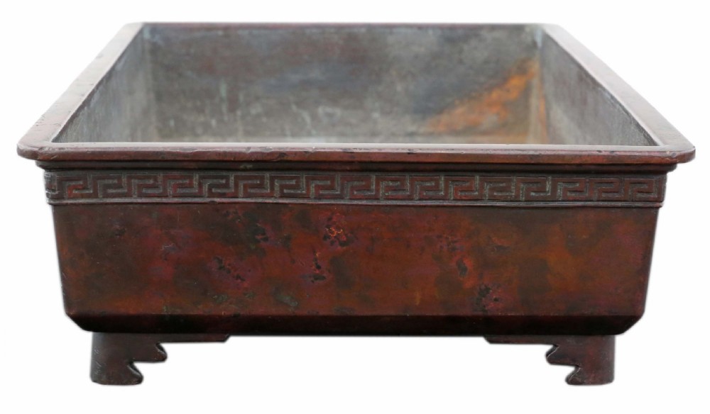 A rectangular dark bronze Japanese suiban planter featuring a key fret relief pattern around the upper border and four corner bracket feet. View II